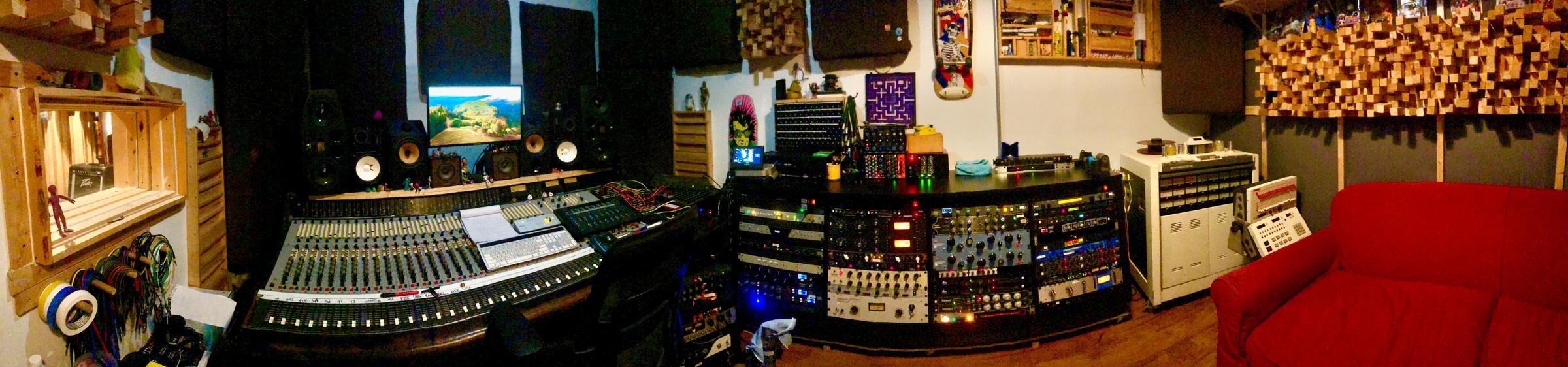 Control room at Cold War Studios — analog console, outboard racks, and monitors